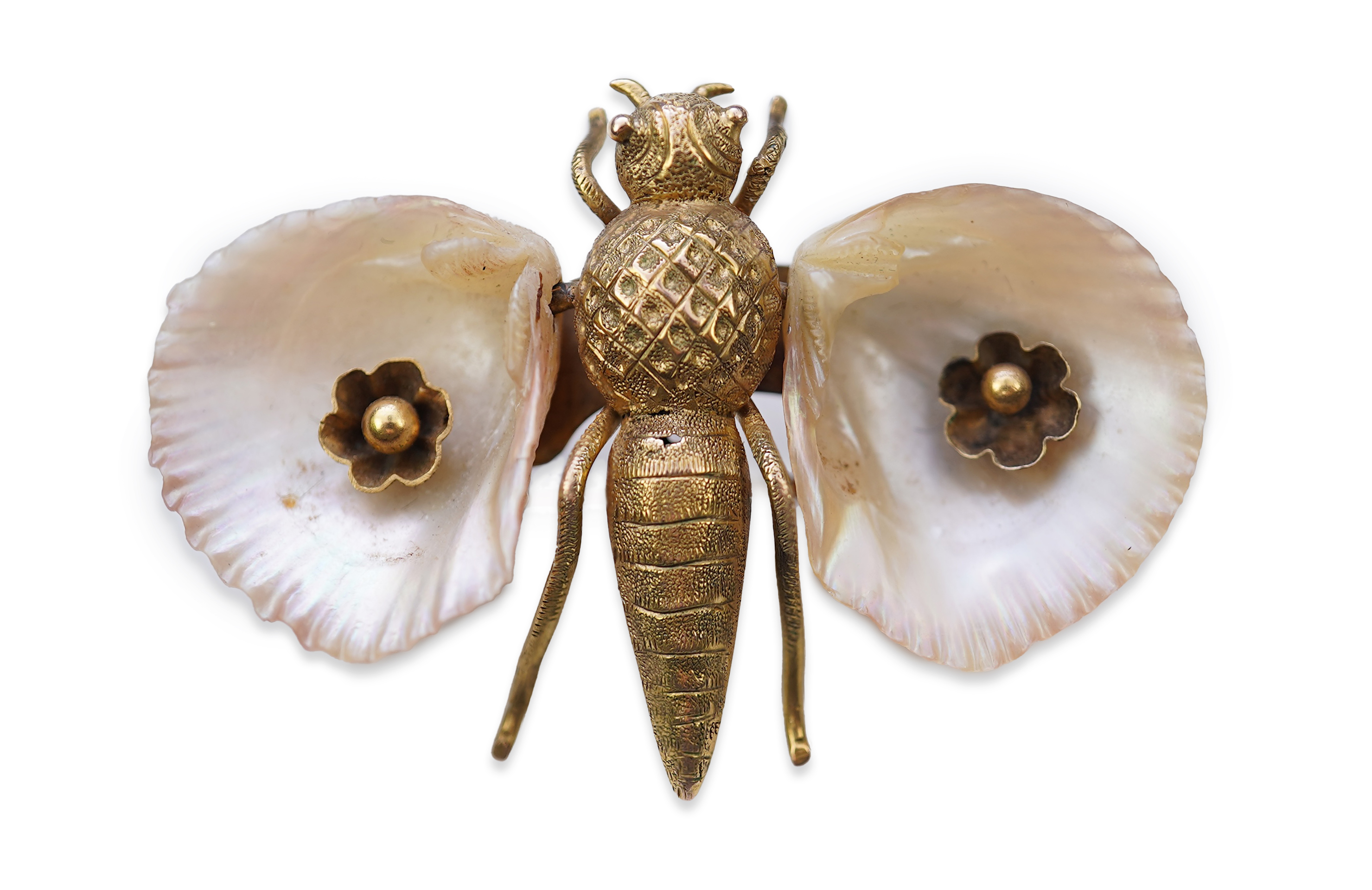 A gold and shell brooch, late 19th century composite